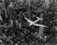 DC-4 Flying over New York City by Margaret Bourke-White