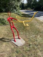 Swinging Jenny - Life Size (Painted Red & Yellow) by Jay Lagemann