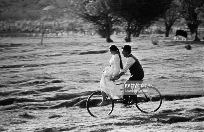 Paul Newman & Katerine Ross on a Bicycle by Lawrence Schiller